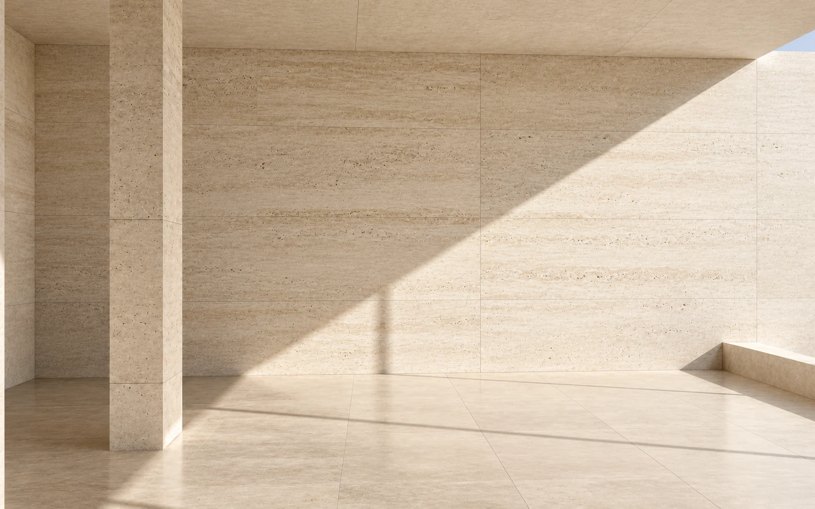 Daylight crossing a quiet travertine interior